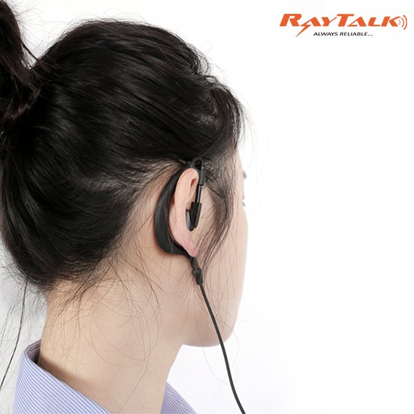 Restaurant staff member wearing a Bluetooth earpiece communicating with the kitchen team