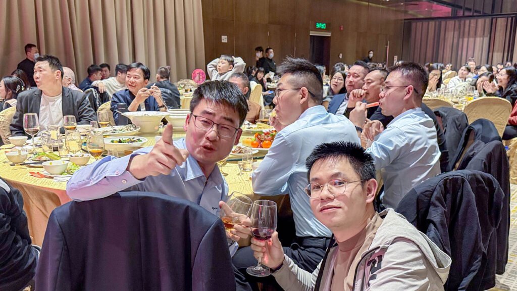 RayTalk team raising glasses at the year-end gala